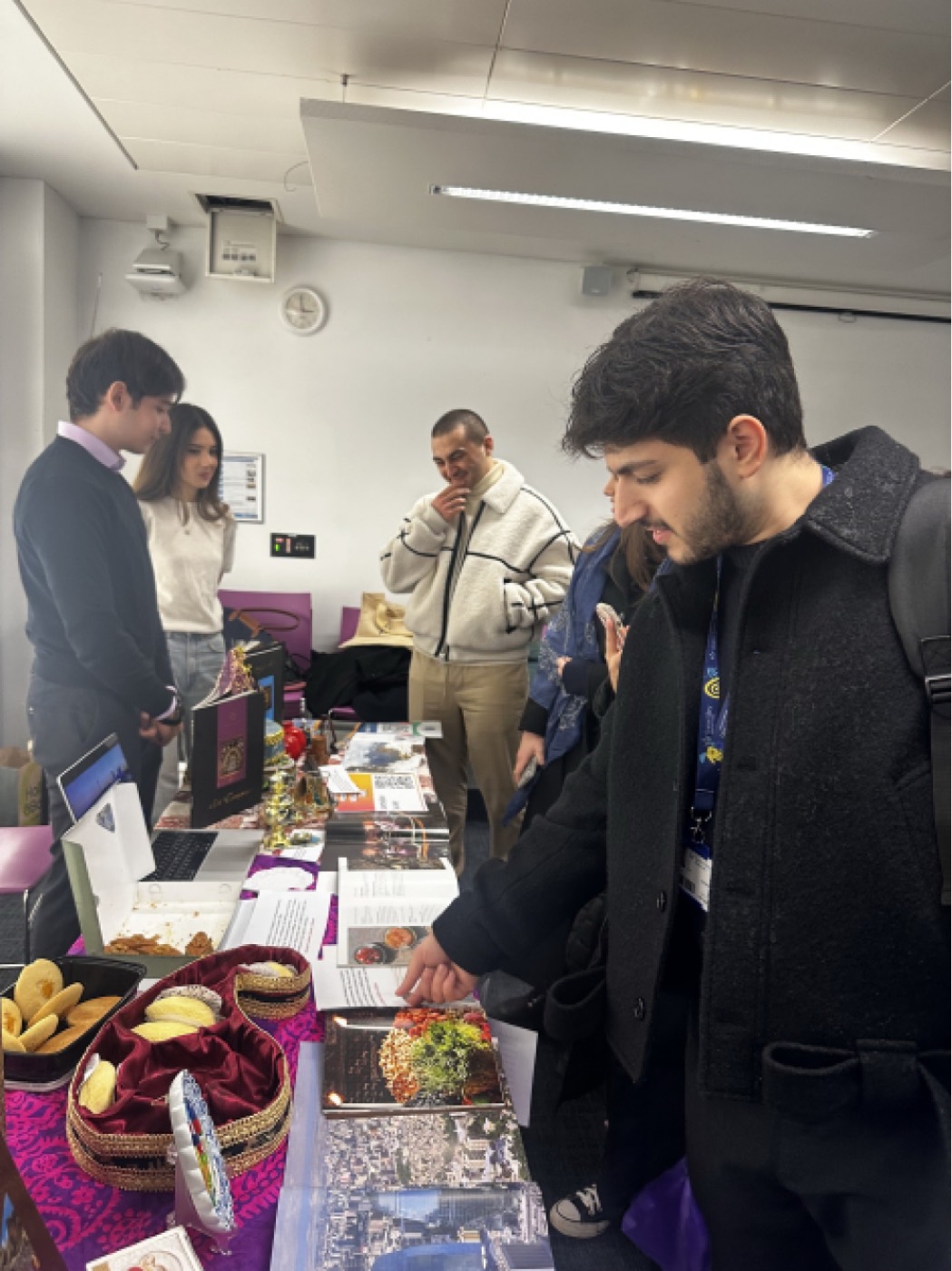 Students exploring the stand's display of Azerbaijani culture