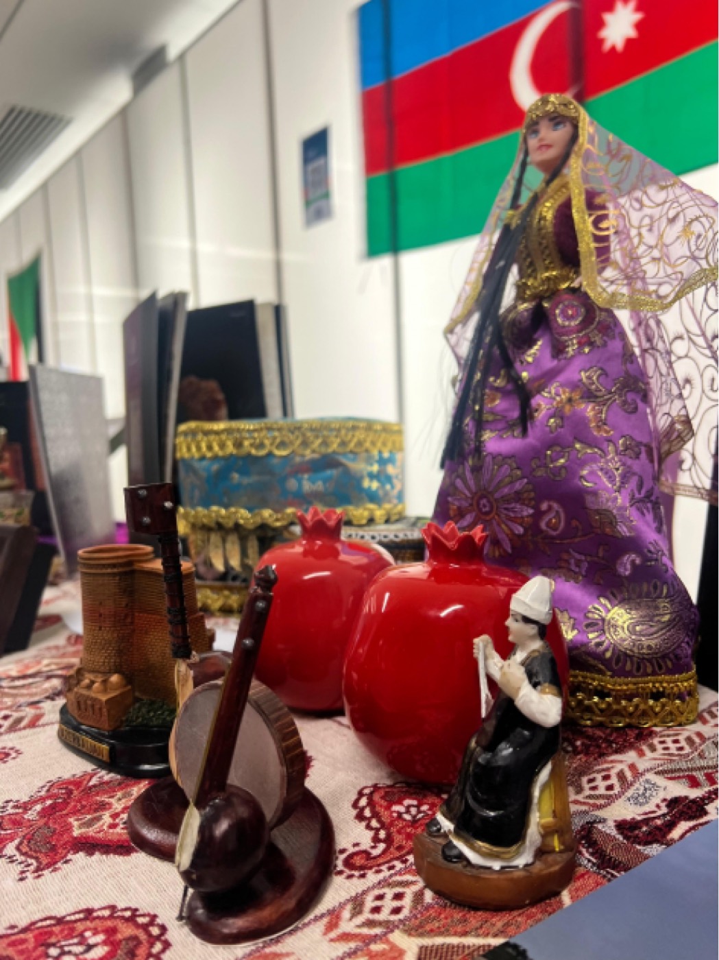 Azerbaijani figurines and pomegranates on display